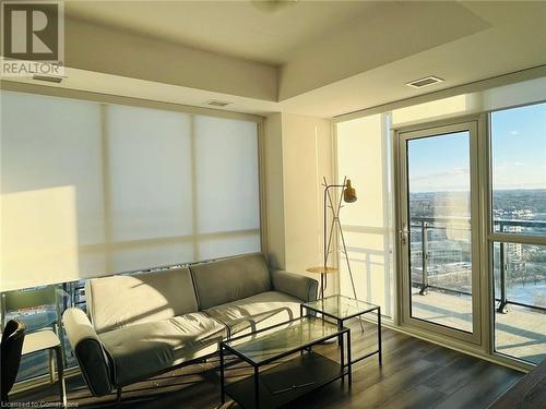 Living room featuring dark hardwood / wood-style flooring - 60 Charles Street Unit# 2205, Kitchener, ON - Indoor Photo Showing Other Room