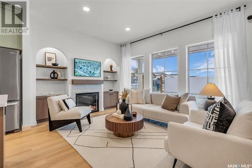 4 720 Brighton Boulevard, Saskatoon, SK - Indoor Photo Showing Living Room With Fireplace