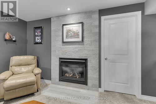 50 Fairview Drive, Lambton Shores (Arkona), ON - Indoor Photo Showing Living Room With Fireplace