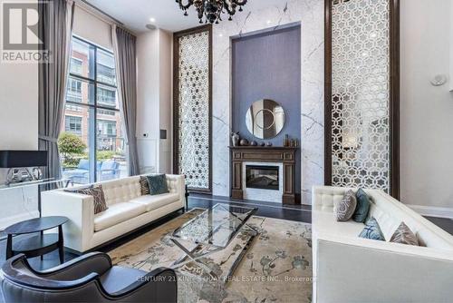 438 - 7608 Yonge Street, Vaughan, ON - Indoor Photo Showing Living Room With Fireplace