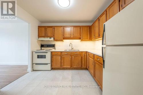 104 - 920 Ford Street, Peterborough (Otonabee), ON - Indoor Photo Showing Kitchen With Double Sink