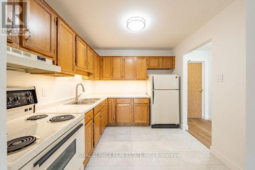 104 - 920 Ford Street, Peterborough (Otonabee), ON - Indoor Photo Showing Kitchen With Double Sink