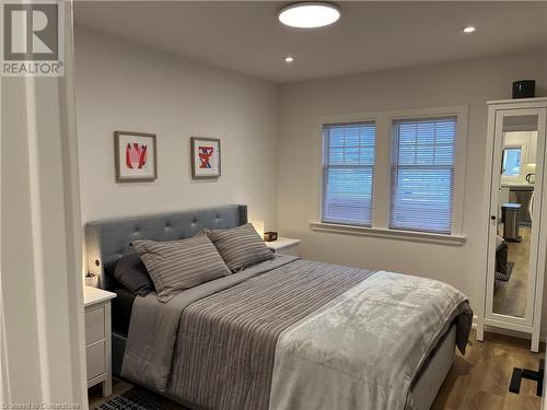 Bedroom featuring dark wood-type flooring - 179 Paradise Road N Unit# Upper, Hamilton, ON - Indoor Photo Showing Bedroom