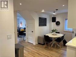 Dining area with light hardwood / wood-style floors - 