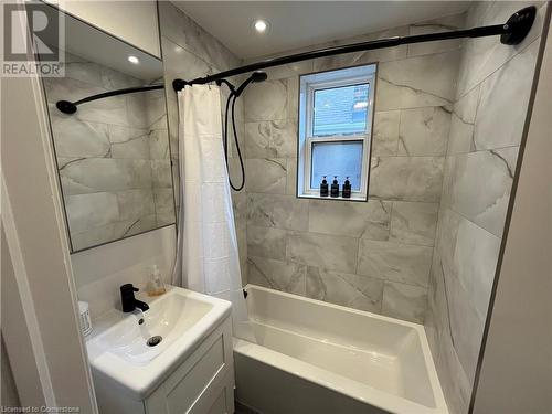 Bathroom with shower / bath combo and vanity - 179 Paradise Road N Unit# Upper, Hamilton, ON - Indoor Photo Showing Bathroom