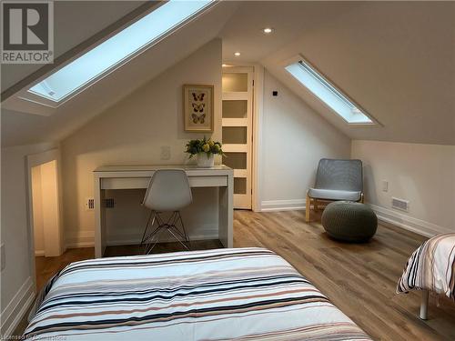 Bedroom with light hardwood / wood-style flooring and lofted ceiling - 179 Paradise Road N Unit# Upper, Hamilton, ON - Indoor Photo Showing Bedroom