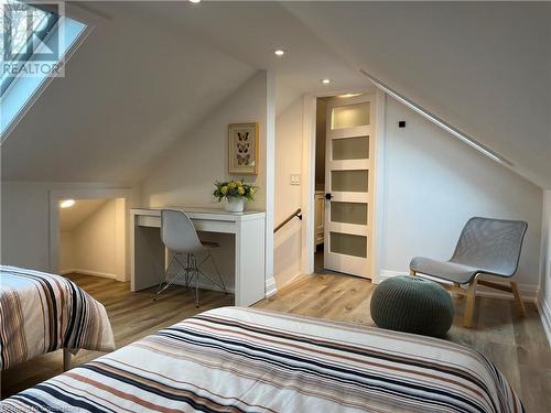 Bedroom featuring light hardwood / wood-style floors and lofted ceiling - 179 Paradise Road N Unit# Upper, Hamilton, ON - Indoor Photo Showing Bedroom