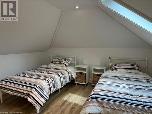 Bedroom with lofted ceiling with skylight and hardwood / wood-style flooring - 179 Paradise Road N Unit# Upper, Hamilton, ON - Indoor Photo Showing Bedroom