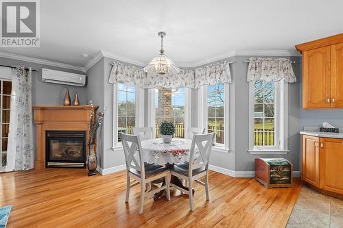 43-45 Foxtrap Access Road, Cbs, NL - Indoor Photo Showing Dining Room With Fireplace