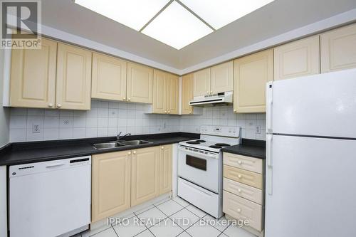 706 - 135 Hillcrest Avenue, Mississauga, ON - Indoor Photo Showing Kitchen With Double Sink