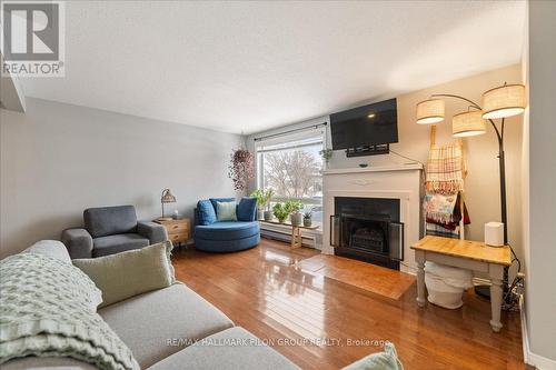 85A - 758 St. Andre Drive, Ottawa, ON - Indoor Photo Showing Living Room With Fireplace