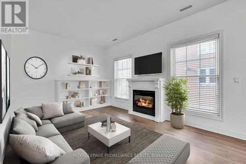 106 Robert'S Row, Cobourg, ON - Indoor Photo Showing Living Room With Fireplace