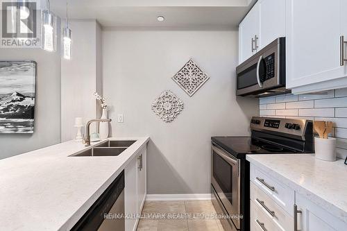 103 - 84 Aspen Springs Drive, Clarington, ON - Indoor Photo Showing Kitchen With Double Sink With Upgraded Kitchen