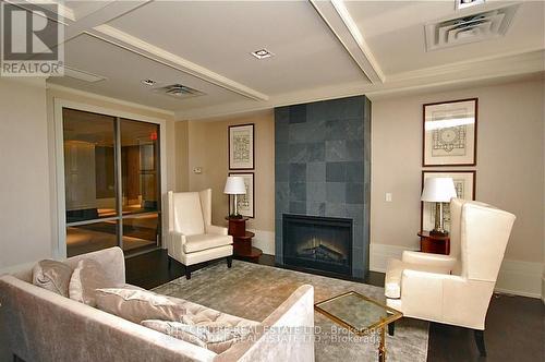 709 - 388 Prince Of Wales Drive, Mississauga, ON - Indoor Photo Showing Living Room With Fireplace