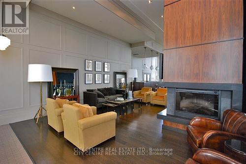 709 - 388 Prince Of Wales Drive, Mississauga, ON - Indoor Photo Showing Living Room With Fireplace