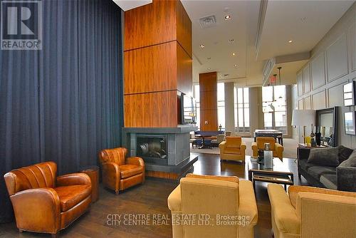 709 - 388 Prince Of Wales Drive, Mississauga, ON - Indoor Photo Showing Living Room With Fireplace