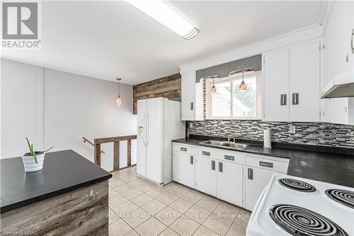 Main - 557 Stirling Avenue S, Kitchener, ON - Indoor Photo Showing Kitchen With Double Sink