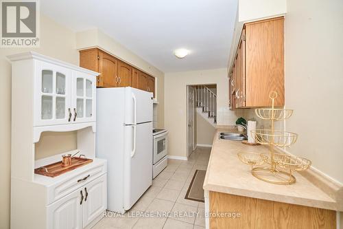 4 - 23 Dynasty Avenue, Hamilton (Stoney Creek), ON - Indoor Photo Showing Kitchen With Double Sink