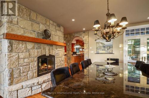 190 Melissa Lane, Tiny, ON - Indoor Photo Showing Dining Room With Fireplace