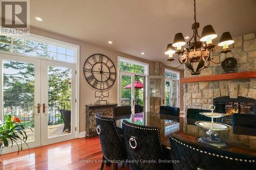 190 Melissa Lane, Tiny, ON - Indoor Photo Showing Dining Room With Fireplace