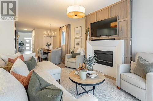 6865 Royal Magnolia Avenue, London, ON - Indoor Photo Showing Living Room With Fireplace