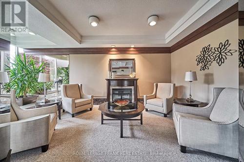 107 - 1890 Valley Farm Road, Pickering (Town Centre), ON - Indoor Photo Showing Living Room With Fireplace