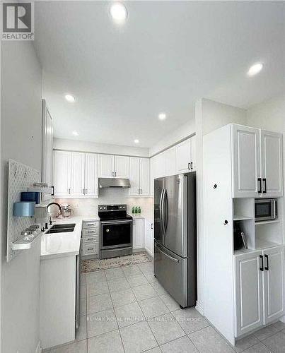 104 Roy Grove Way, Markham, ON - Indoor Photo Showing Kitchen With Double Sink