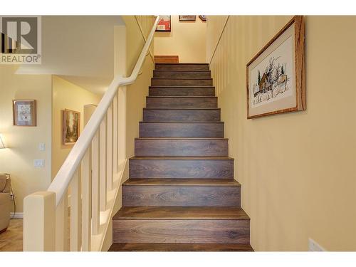 Laminate floors on stairs - 620 Arrowleaf Lane, Kelowna, BC - Indoor Photo Showing Other Room