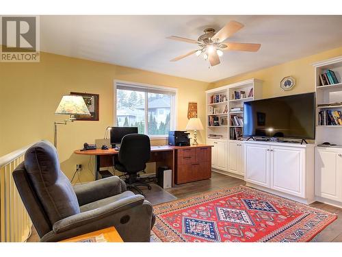 Cozy loft area with built in bookshelves - 620 Arrowleaf Lane, Kelowna, BC - Indoor Photo Showing Office