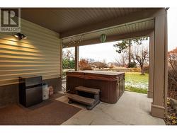 Covered patio with hot tub - 