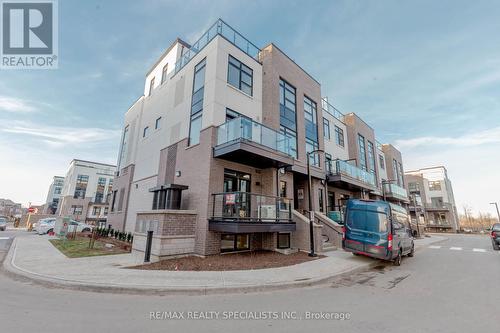 104 - 1597 Rose Way, Milton, ON - Outdoor With Balcony With Facade