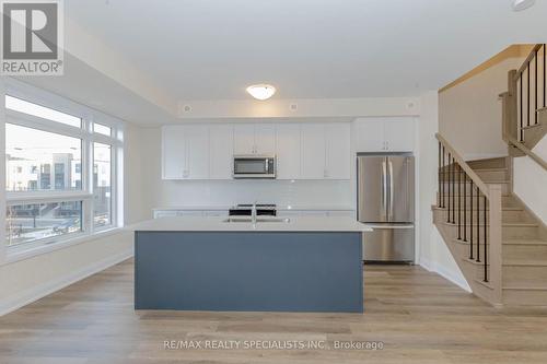 104 - 1597 Rose Way, Milton, ON - Indoor Photo Showing Kitchen With Stainless Steel Kitchen With Upgraded Kitchen