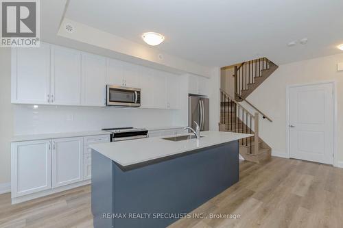 104 - 1597 Rose Way, Milton, ON - Indoor Photo Showing Kitchen