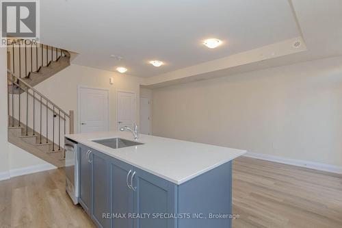 104 - 1597 Rose Way, Milton, ON - Indoor Photo Showing Kitchen