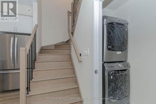 104 - 1597 Rose Way, Milton, ON - Indoor Photo Showing Laundry Room