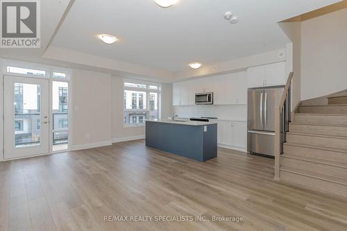 104 - 1597 Rose Way, Milton, ON - Indoor Photo Showing Kitchen With Stainless Steel Kitchen With Upgraded Kitchen