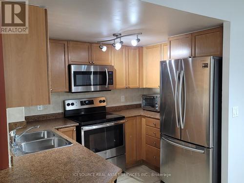 506 - 4080 Living Arts Drive, Mississauga, ON - Indoor Photo Showing Kitchen With Stainless Steel Kitchen With Double Sink