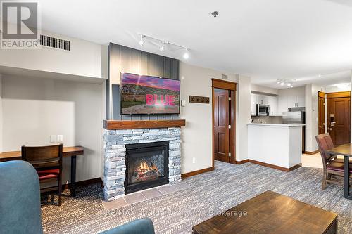 326 - 152 Jozo Weider Boulevard S, Blue Mountains (Blue Mountain Resort Area), ON - Indoor Photo Showing Living Room With Fireplace