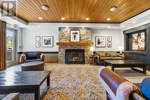 326 - 152 Jozo Weider Boulevard S, Blue Mountains (Blue Mountain Resort Area), ON - Indoor Photo Showing Living Room With Fireplace