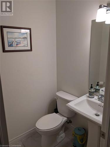 Bathroom featuring tile patterned floors and toilet - 9 Hyde Park Mews, Kitchener, ON - Indoor Photo Showing Bathroom