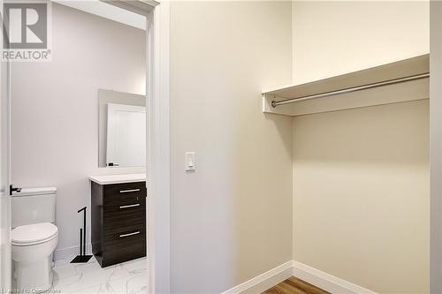 Double sided closet that enters the bathroom. - 15 Main Street Unit# 404, Cambridge, ON - Indoor