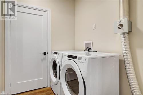 Laundry room featuring washer and dryer - 15 Main Street Unit# 404, Cambridge, ON - Indoor Photo Showing Laundry Room