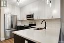 15 Main Street Unit# 404, Cambridge, ON  - Indoor Photo Showing Kitchen With Stainless Steel Kitchen With Double Sink With Upgraded Kitchen 