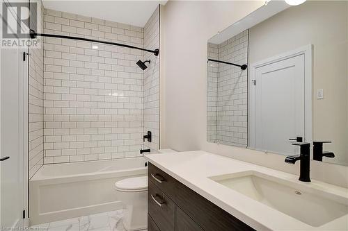 Full bathroom featuring vanity, toilet, and tiled shower / bath - 15 Main Street Unit# 404, Cambridge, ON - Indoor Photo Showing Bathroom