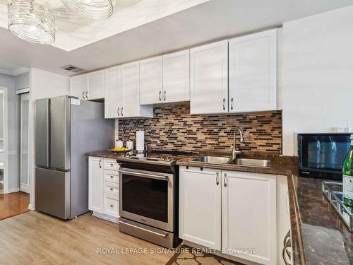 504-8 Lisa St, Brampton, ON - Indoor Photo Showing Kitchen With Stainless Steel Kitchen With Double Sink