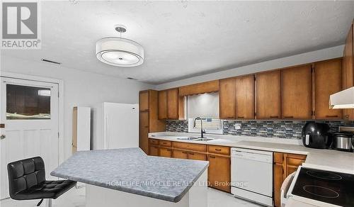 22 William Street S, Minto, ON - Indoor Photo Showing Kitchen With Double Sink