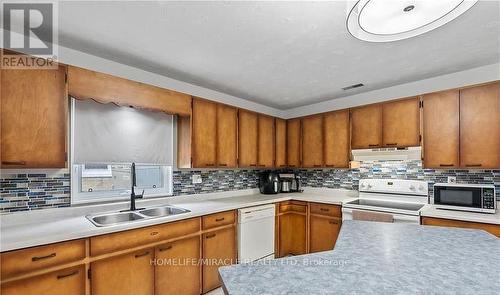 22 William Street S, Minto, ON - Indoor Photo Showing Kitchen With Double Sink