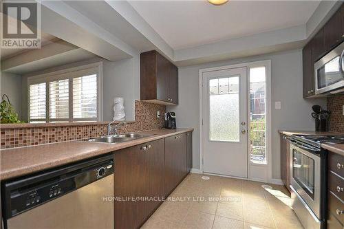 765 Challinor Terrace, Milton, ON - Indoor Photo Showing Kitchen With Stainless Steel Kitchen With Double Sink