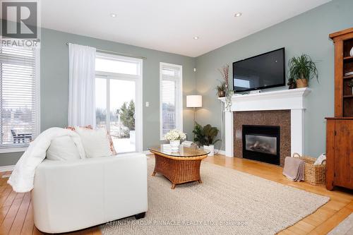 54 Ellis Crescent, Kawartha Lakes (Lindsay), ON - Indoor Photo Showing Living Room With Fireplace