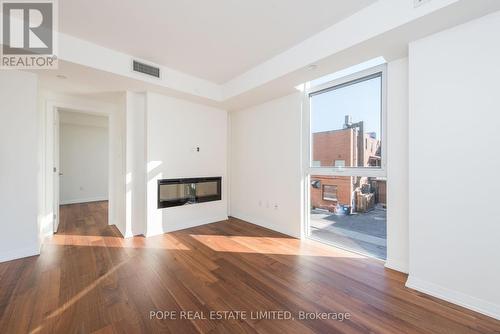 208 - 835 St Clair Avenue W, Toronto, ON - Indoor Photo Showing Other Room With Fireplace